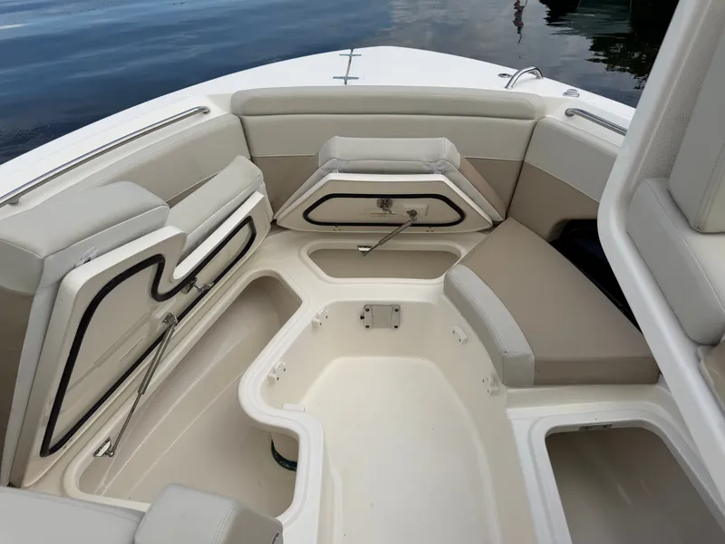 Slide: The Image of The image shows the bow area of a Boston Whaler 280 Vantage with seating and storage compartments. - 27