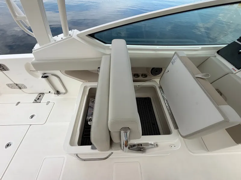Slide: The Image of The 2027 Boston Whaler 280 Vantage features a sleek, white interior with a foldable seat. - 37