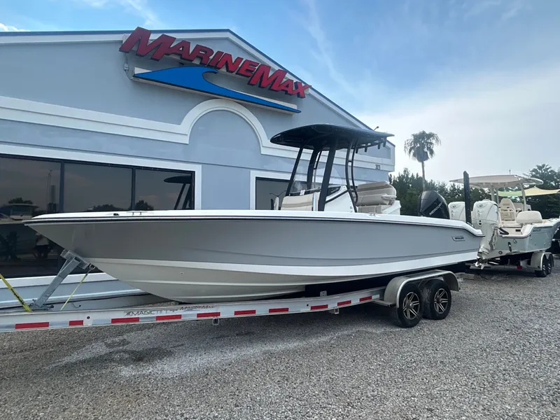 Slide: The Image of A 2027 Boston Whaler 250 Dauntless on a trailer in front of a MarineMax building. - 6