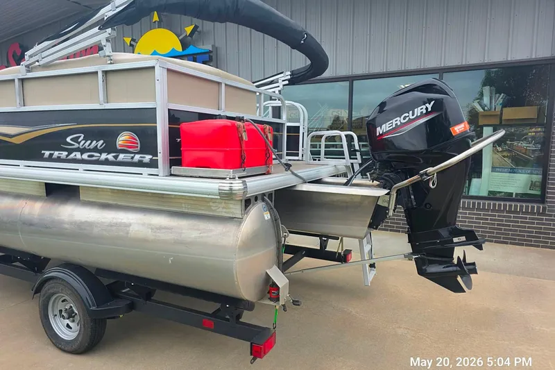 Slide: The Image of 2021 Sun Tracker Bass Buggy 16 XL Select pontoon boat with Mercury outboard motor. - 2