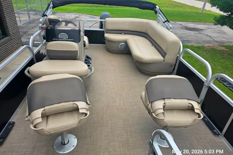 Slide: The Image of 2021 Sun Tracker Bass Buggy 16 XL Select pontoon boat with beige seating and spacious deck. - 3