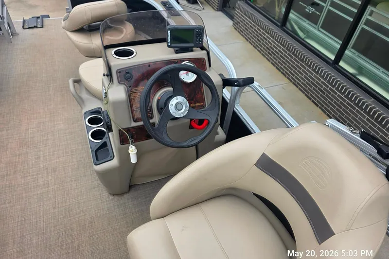 Slide: The Image of 2021 Sun Tracker Bass Buggy 16 XL Select boat interior with steering console and seating. - 6