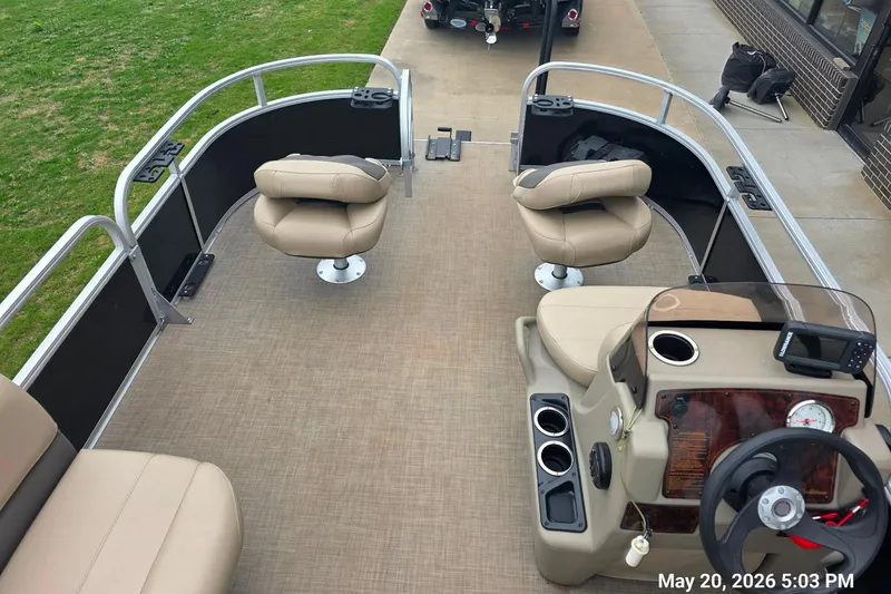 Slide: The Image of 2021 Sun Tracker Bass Buggy 16 XL Select pontoon boat interior with seating and steering console. - 7