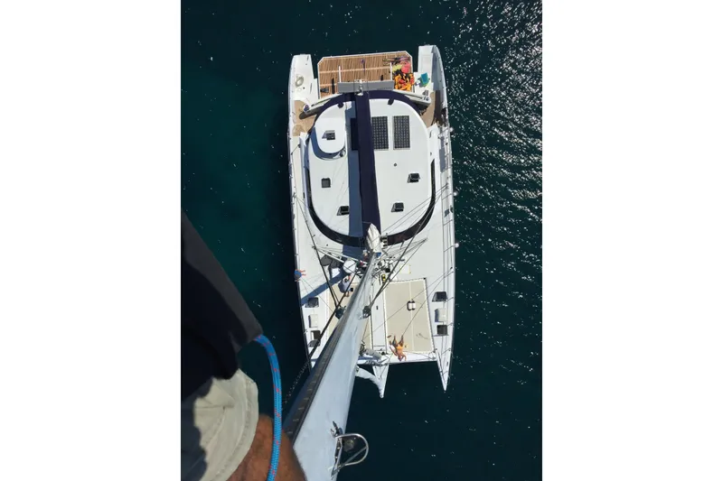 Slide: The Image of Aerial view of a 2006 Lidgard Custom Catamaran on clear water. - 10