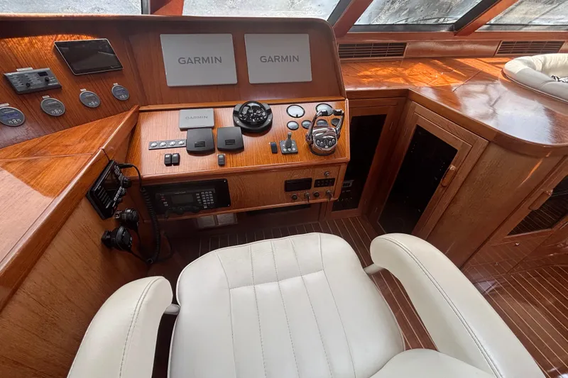 Slide: The Image of Luxurious 2006 Lidgard Custom Catamaran helm with Garmin navigation and elegant wood finish. - 17