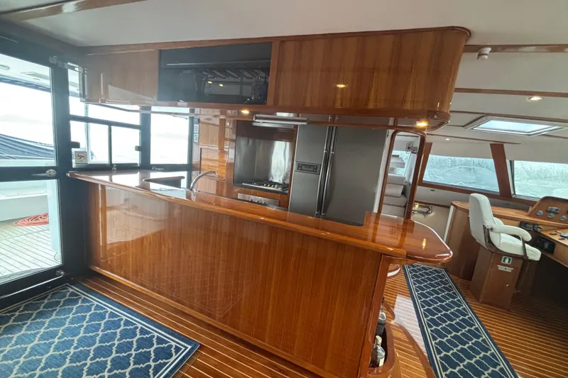 Slide: The Image of Luxurious interior of 2006 Lidgard Custom Catamaran with polished wood and modern amenities. - 19