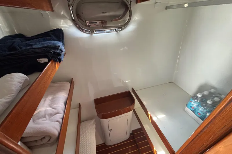 Slide: The Image of Interior of 2006 Lidgard Custom Catamaran cabin with bunk beds and storage. - 31