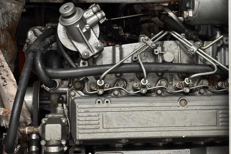 Slide: The Image of Engine of a 2006 Lidgard Custom Catamaran, showcasing intricate mechanical components. - 36