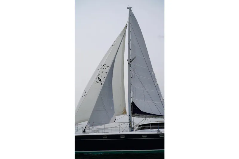 Slide: The Image of Sailing catamaran with white sails, Lidgard Custom Catamaran, 2006 model. - 46