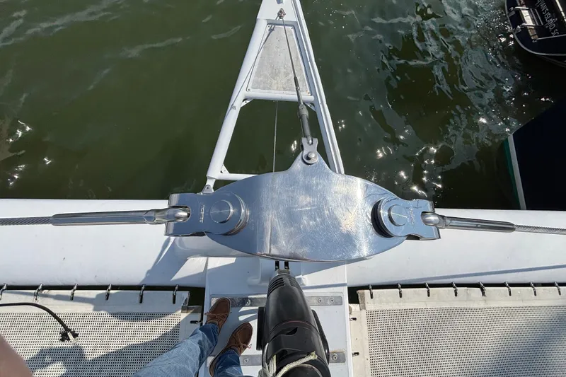 Slide: The Image of Bow view of 2006 Lidgard Custom Catamaran with stainless steel rigging over water. - 5