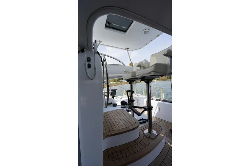 Slide: The Image of Helm station of 2006 Lidgard Custom Catamaran with wooden deck and dual seats. - 9