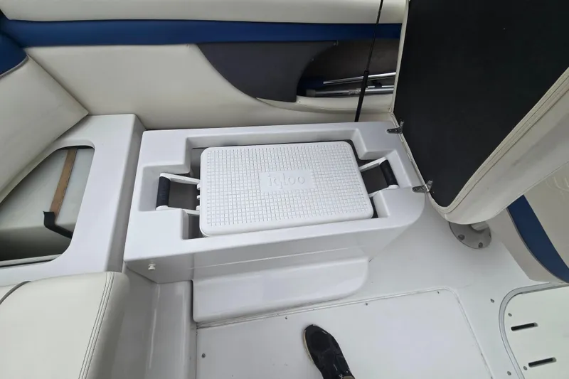 Slide: The Image of 2001 Four Winns 230 Horizon boat interior with built-in Igloo cooler storage. - 23