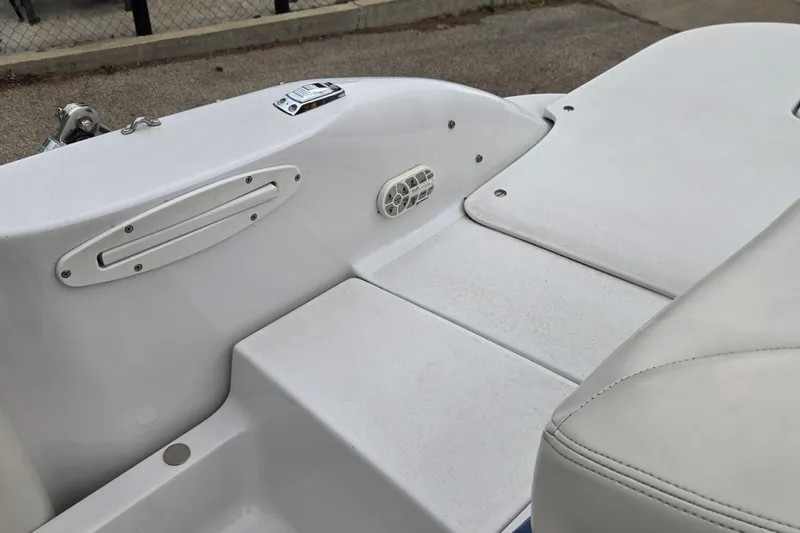 Slide: The Image of 2001 Four Winns 230 Horizon boat interior, featuring white seating and deck details. - 25