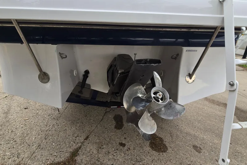 Slide: The Image of Rear view of a 2001 Four Winns 230 Horizon boat showing the propeller and stern details. - 28