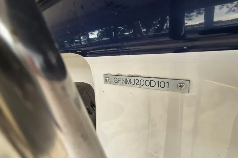 Slide: The Image of 2001 Four Winns 230 Horizon boat hull identification number plate close-up. - 29