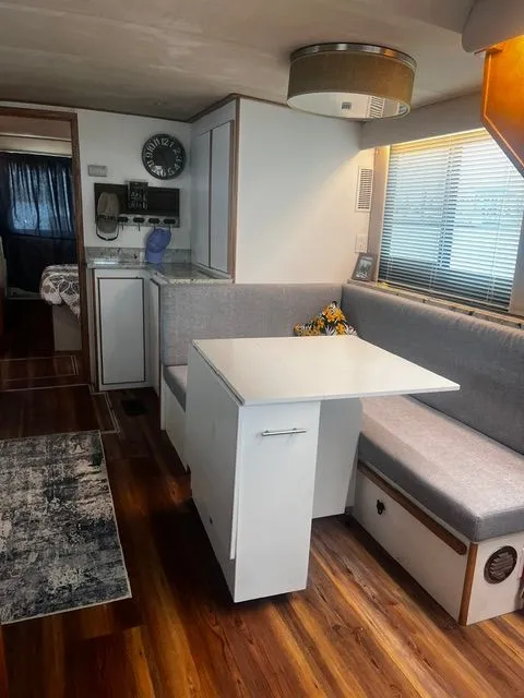 Slide: The Image of Interior of a 1997 Bluewater Yachts 510 with modern seating area. - 8