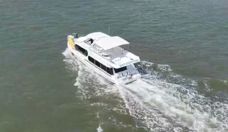Slide: The Image of 1997 Bluewater Yachts 510 cruising on open water. - 2