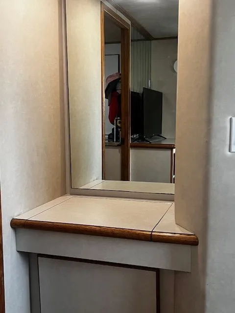 Slide: The Image of Interior of 1997 Bluewater Yachts 510 with mirror and TV. - 11