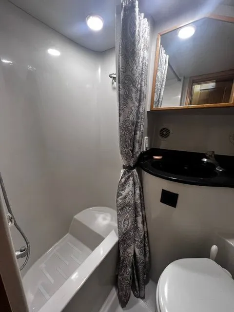 Slide: The Image of Bathroom in 1997 Bluewater Yachts 510 with shower and toilet. - 6
