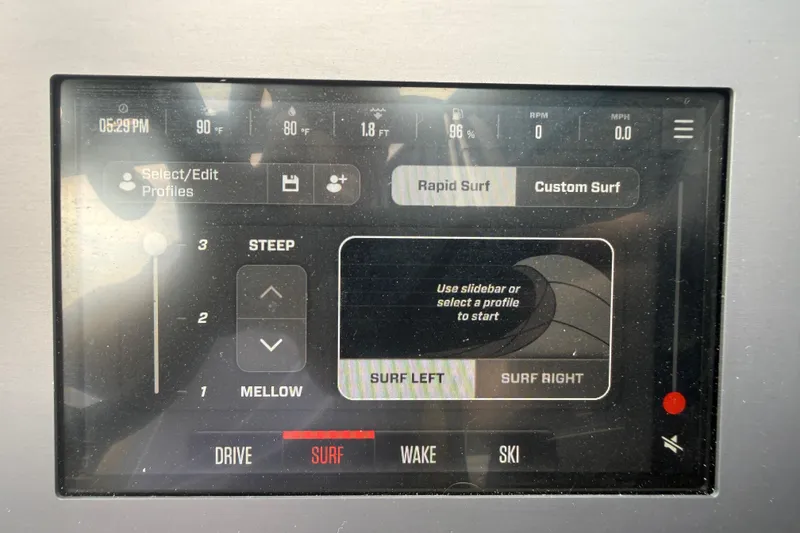 Slide: The Image of Touchscreen display of a 2025 MasterCraft NXT24 boat, showing surf settings and profiles. - 11