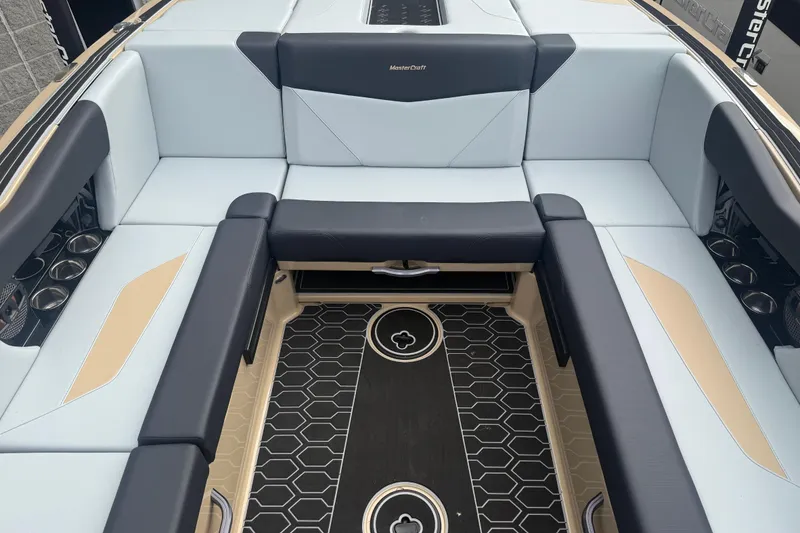 Slide: The Image of 2025 MasterCraft NXT24 boat interior with sleek seating and stylish flooring design. - 20
