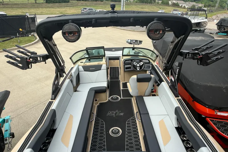 Slide: The Image of 2025 MasterCraft NXT24 boat interior with sleek seating and advanced dashboard features. - 21