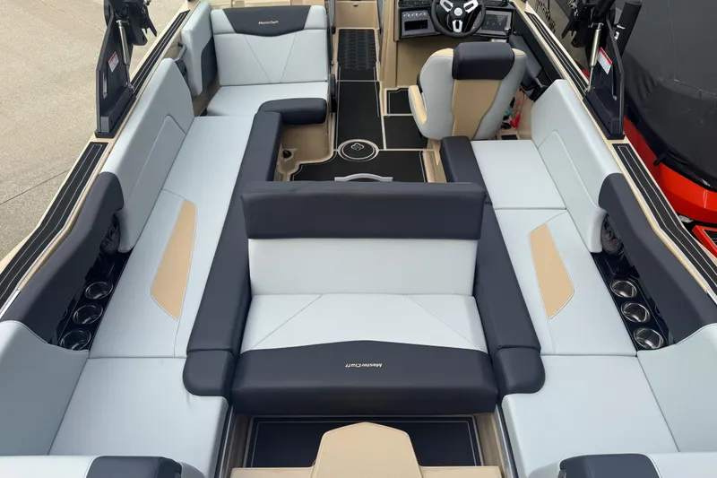 Slide: The Image of 2025 MasterCraft NXT24 boat interior with spacious seating and modern design. - 24