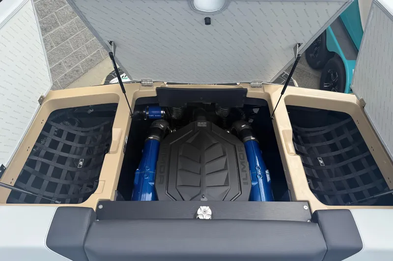 Slide: The Image of 2025 MasterCraft NXT24 engine compartment with Ilmor engine, open storage hatches. - 25