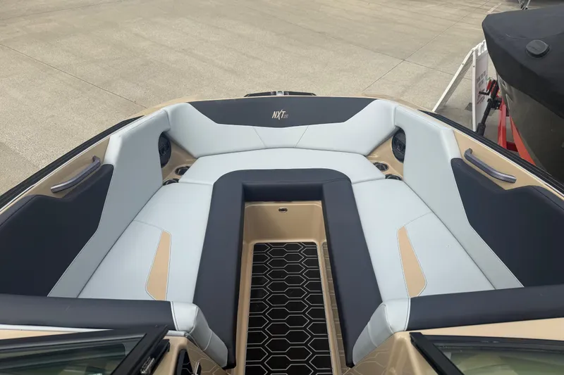 Slide: The Image of 2025 MasterCraft NXT24 boat interior with sleek seating and modern design. - 3