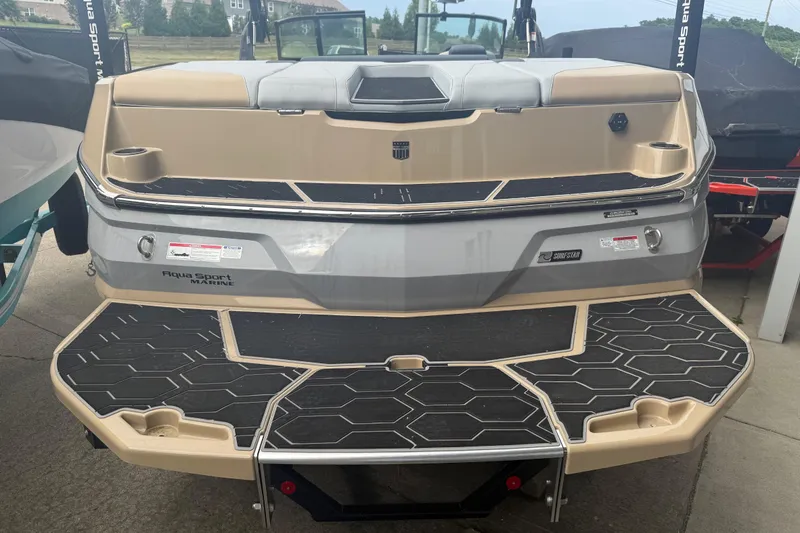 Slide: The Image of 2025 MasterCraft NXT24 boat rear view with Aqua Sport Marine branding. - 30