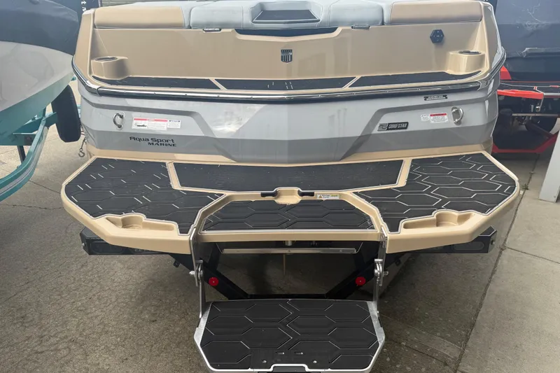 Slide: The Image of 2025 MasterCraft NXT24 boat rear view with swim platform and step ladder. - 31