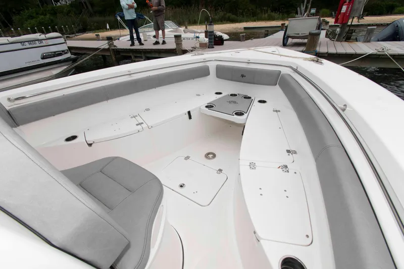 Slide: The Image of 2021 Sea Pro 259 Center Console boat interior with seating and storage compartments. - 16