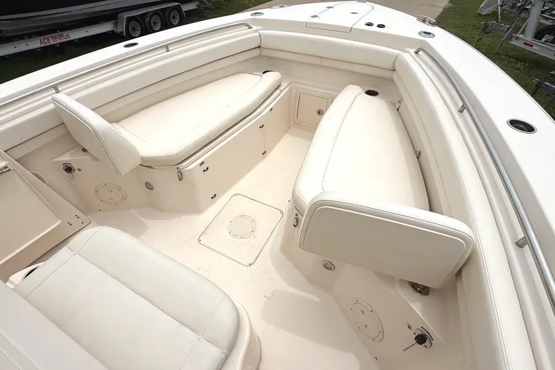 Slide: The Image of 2018 Grady-White Canyon 306 boat interior with spacious seating and storage compartments. - 14
