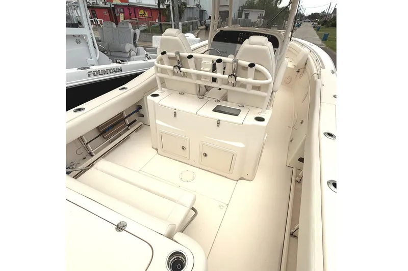 Slide: The Image of 2018 Grady-White Canyon 306 boat interior with seating and storage compartments. - 16