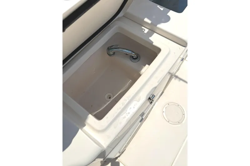Slide: The Image of Open storage compartment on 2018 Grady-White Canyon 306 boat deck. - 18