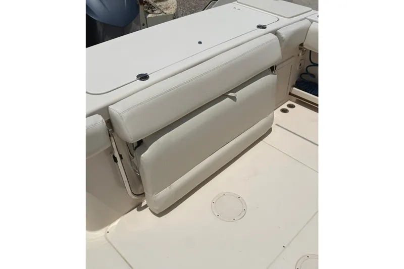 Slide: The Image of 2018 Grady-White Canyon 306 boat with foldable white seat on deck. - 22