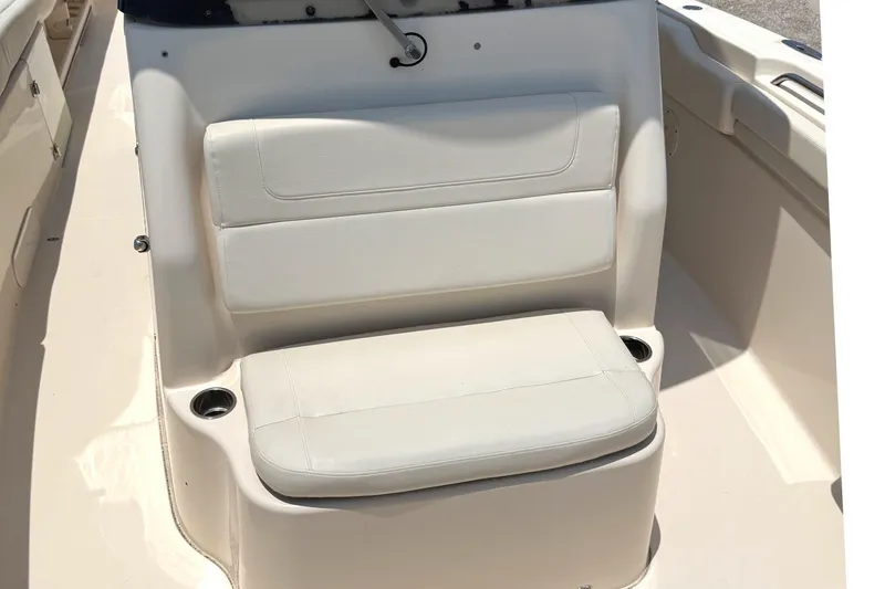 Slide: The Image of 2018 Grady-White Canyon 306 boat seat with cup holders, beige upholstery. - 25