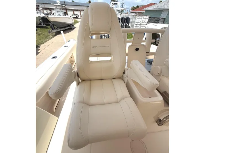 Slide: The Image of 2018 Grady-White Canyon 306 boat seat with armrests, showcasing luxury and comfort. - 31