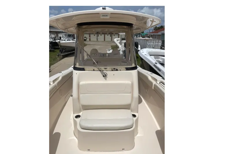 Slide: The Image of 2018 Grady-White Canyon 306 boat interior with seating and console view. - 34