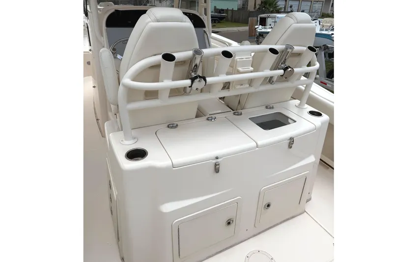 Slide: The Image of 2018 Grady-White Canyon 306 boat interior with rod holders and storage compartments. - 35