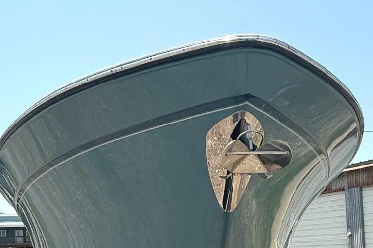 Slide: The Image of 2018 Grady-White Canyon 306 boat bow with anchor, viewed from below against blue sky. - 4