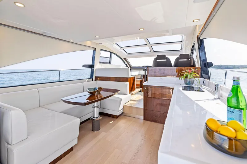 Slide: The Image of Luxurious interior of 2025 Fairline Targa 50 GT yacht with modern seating and panoramic windows. - 21