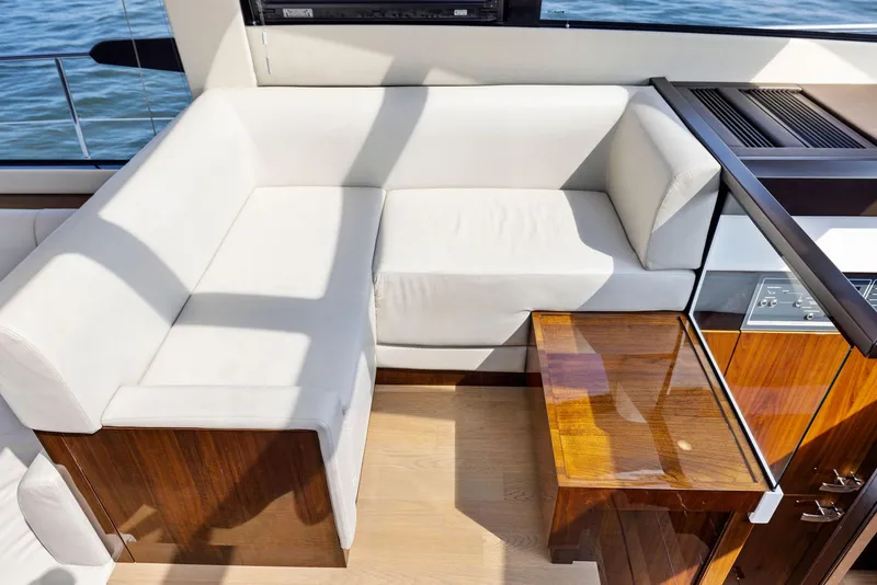 Slide: The Image of Luxurious interior of 2025 Fairline Targa 50 GT yacht with white seating and wooden accents. - 25