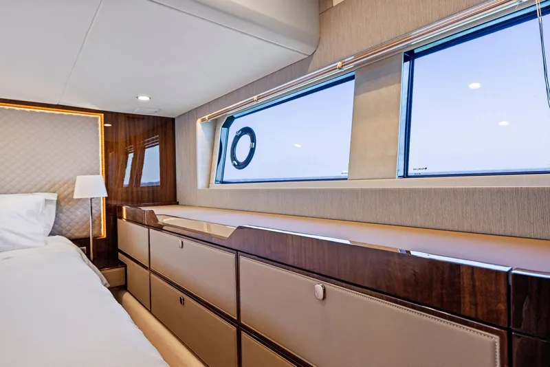Slide: The Image of Luxurious interior of 2025 Fairline Targa 50 GT yacht cabin with elegant wood finishes. - 32