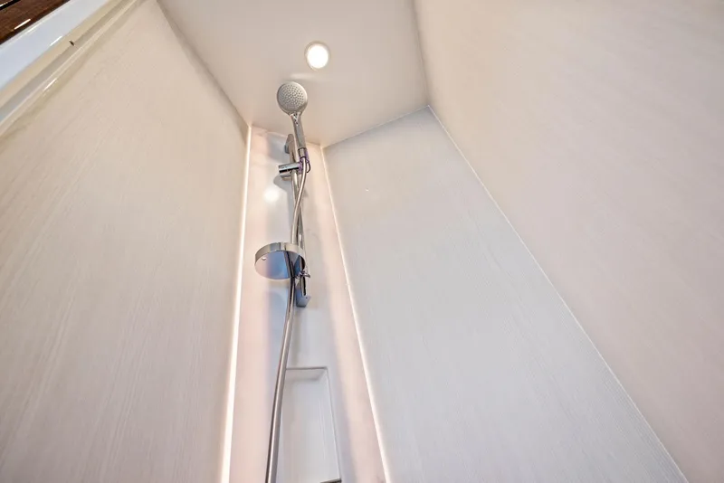 Slide: The Image of Shower area in 2025 Fairline Targa 50 GT yacht, featuring modern fixtures and lighting. - 36