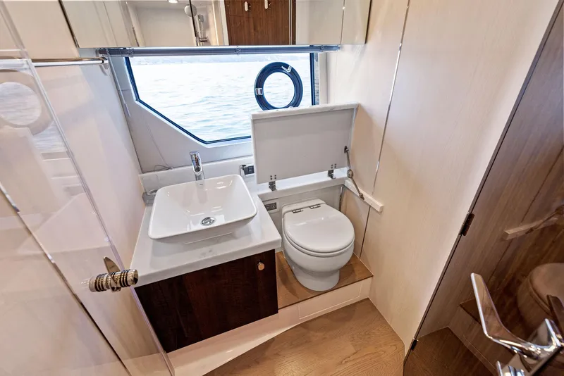 Slide: The Image of Luxury bathroom in 2025 Fairline Targa 50 GT yacht, featuring modern sink and toilet. - 39