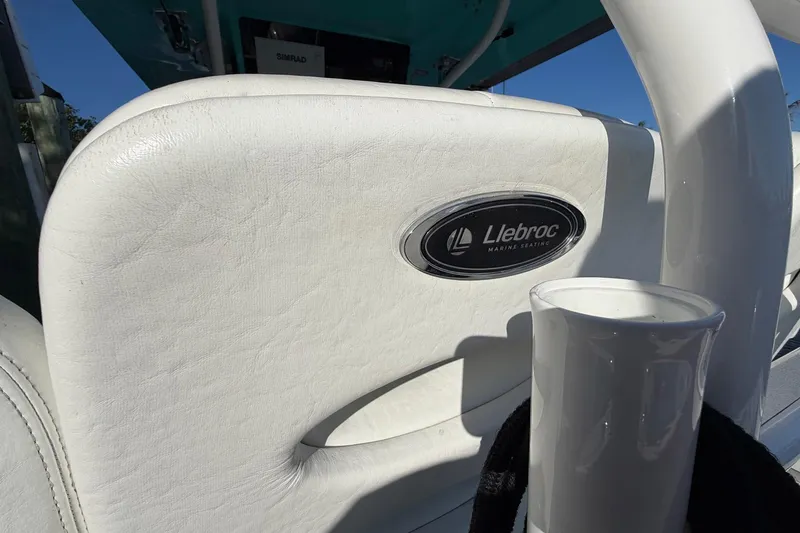 Slide: The Image of White Llebroc marine seating on 2002 Regulator 26 Center Console boat. - 20