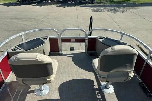 Slide: The Image of 2025 Sun Tracker Bass Buggy 18 DLX pontoon boat with dual seating and storage compartments. - 6