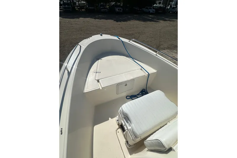 Slide: The Image of 2005 Sea Hunt Triton 186 boat interior with seating and storage compartments. - 12