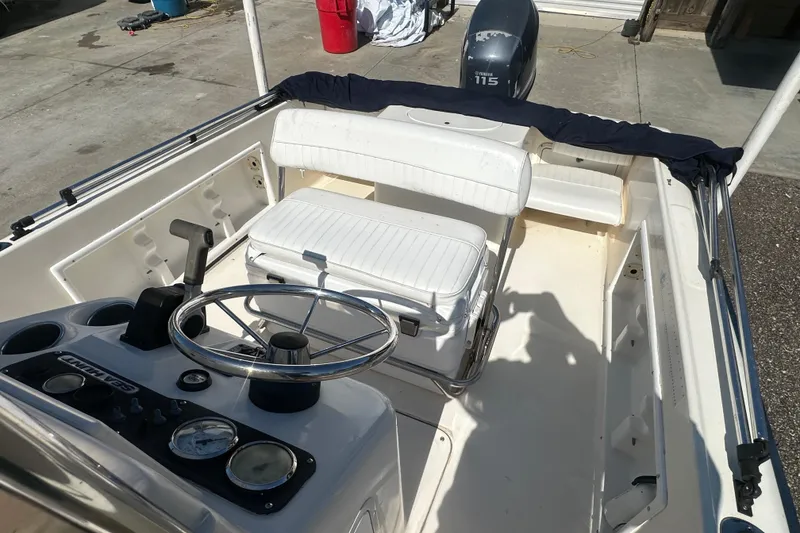 Slide: The Image of 2005 Sea Hunt Triton 186 boat interior with steering wheel and seating. - 17